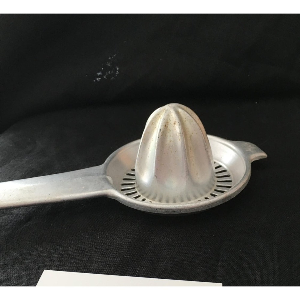 Small, handheld aluminum juicer tool vintage